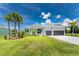 Single-Gathering home with two-car garage and palm trees at 9973 Calumet Blvd, Port Charlotte, FL 33981