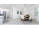 Open concept dining area with a round table and chairs, near kitchen at 9973 Calumet Blvd, Port Charlotte, FL 33981
