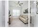 Relaxing den with light flooring, comfortable seating, and a large window at 9973 Calumet Blvd, Port Charlotte, FL 33981