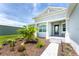 House exterior with landscaped walkway and porch at 9973 Calumet Blvd, Port Charlotte, FL 33981