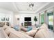 Spacious living room with sectional sofa and large TV at 9973 Calumet Blvd, Port Charlotte, FL 33981