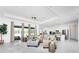 Bright living room with sectional sofa, access to backyard, ceiling fan at 9973 Calumet Blvd, Port Charlotte, FL 33981