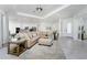 Spacious living room with sectional sofa, ceiling fan, and open floor plan at 9973 Calumet Blvd, Port Charlotte, FL 33981