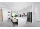 Modern white kitchen with stainless steel appliances and an island at 9973 Calumet Blvd, Port Charlotte, FL 33981