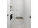Clean laundry room featuring washer, dryer, and storage at 9973 Calumet Blvd, Port Charlotte, FL 33981