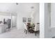 Spacious dining area with a round table and chairs, open to kitchen at 9973 Calumet Blvd, Port Charlotte, FL 33981