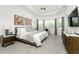 Spacious main bedroom with king-size bed and large windows at 9973 Calumet Blvd, Port Charlotte, FL 33981