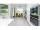 Bright kitchen with stainless steel appliances and access to a patio at 9973 Calumet Blvd, Port Charlotte, FL 33981