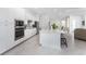 Open concept kitchen with white cabinets and island at 9973 Calumet Blvd, Port Charlotte, FL 33981