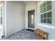 Front entrance with paver walkway and bench at 9973 Calumet Blvd, Port Charlotte, FL 33981