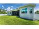 House exterior with backyard, patio, and privacy fence at 9973 Calumet Blvd, Port Charlotte, FL 33981