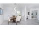 Spacious dining area with round table and chairs, adjacent to kitchen at 9973 Calumet Blvd, Port Charlotte, FL 33981