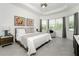 Bright and airy main bedroom with king bed and ensuite bathroom access at 9973 Calumet Blvd, Port Charlotte, FL 33981