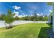 Spacious backyard with grassy lawn and privacy fence at 9973 Calumet Blvd, Port Charlotte, FL 33981