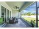 Relaxing screened patio overlooking backyard with seating at 9973 Calumet Blvd, Port Charlotte, FL 33981