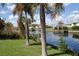 Scenic waterfront property with private canal access and lush landscaping at 839 Conreid Ne Dr, Port Charlotte, FL 33952