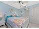 Bedroom with queen bed, light blue walls, and ceiling fan at 132 Mccabe St, Port Charlotte, FL 33953