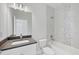 Modern bathroom with bathtub and marble tile at 580 Adalia Ter, Port Charlotte, FL 33953