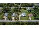 Aerial view showcasing a large home, detached workshop and expansive lot at 21225 Bachmann Blvd, Port Charlotte, FL 33954