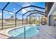 Enjoy this refreshing pool and patio area with water views at 13164 Amaryllis Cir, Port Charlotte, FL 33981