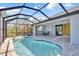 Enjoy the screened-in pool and patio with adjacent dining area at 13164 Amaryllis Cir, Port Charlotte, FL 33981