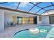 Enjoy the open-concept pool area and patio with kitchen access at 13164 Amaryllis Cir, Port Charlotte, FL 33981