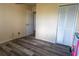 Bright bedroom with wood-look flooring and a spacious closet at 860 Columbia St, Port Charlotte, FL 33948