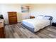 Cozy bedroom with a dresser and a full-size bed at 860 Columbia St, Port Charlotte, FL 33948
