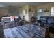 Living room with grey leather couches and wood-look flooring at 860 Columbia St, Port Charlotte, FL 33948