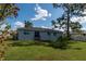 Spacious backyard with patio and lush landscaping at 860 Columbia St, Port Charlotte, FL 33948