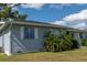 Ranch-style home with light blue siding at 860 Columbia St, Port Charlotte, FL 33948