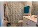 Bathroom with shower/tub combo and starfish-themed shower curtain at 860 Columbia St, Port Charlotte, FL 33948