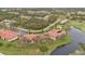 Aerial view of condo community with pool and golf course at 1355 Saxony Cir # 211, Punta Gorda, FL 33983