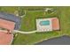 Community pool with surrounding patio and landscaping at 1355 Saxony Cir # 211, Punta Gorda, FL 33983