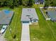 Aerial view of a single-Gathering home with well-maintained landscaping at 2404 Hanford Ln, North Port, FL 34288