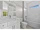 Bright bathroom with vanity, tub, and shower combo at 2404 Hanford Ln, North Port, FL 34288