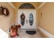 Elegant double front doors with decorative glass and a wreath at 2868 Coral Way, Punta Gorda, FL 33950