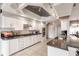 Well-equipped kitchen featuring white cabinets and granite countertops at 2868 Coral Way, Punta Gorda, FL 33950