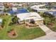 Bird's-eye view of a waterfront property with mature tropical landscaping at 2868 Coral Way, Punta Gorda, FL 33950