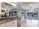 Updated kitchen with granite countertops, stainless steel appliances, and water views at 2868 Coral Way, Punta Gorda, FL 33950