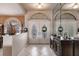 Bright and spacious entryway with decorative accents and hardwood floor at 2868 Coral Way, Punta Gorda, FL 33950