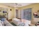 Bright living room with wood floors, a sofa, and sliding doors to patio at 2868 Coral Way, Punta Gorda, FL 33950
