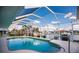 Screened-in pool with steps and water views at 2868 Coral Way, Punta Gorda, FL 33950