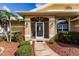 Inviting front porch with a screened entryway and walkway at 2868 Coral Way, Punta Gorda, FL 33950