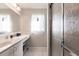 Clean bathroom with a vanity, sink, and shower at 2868 Coral Way, Punta Gorda, FL 33950