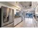 Modern kitchen boasts stainless steel appliances and views of the water at 2868 Coral Way, Punta Gorda, FL 33950