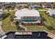 Aerial view of house, pool, and private dock at 2868 Coral Way, Punta Gorda, FL 33950