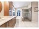 Spa-like bathroom featuring double sinks, a large tub, and a separate shower at 2868 Coral Way, Punta Gorda, FL 33950