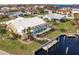 Aerial view showing house, pool, dock, and landscaping at 2868 Coral Way, Punta Gorda, FL 33950