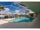 Inviting pool area with screened enclosure, offering water views at 2868 Coral Way, Punta Gorda, FL 33950